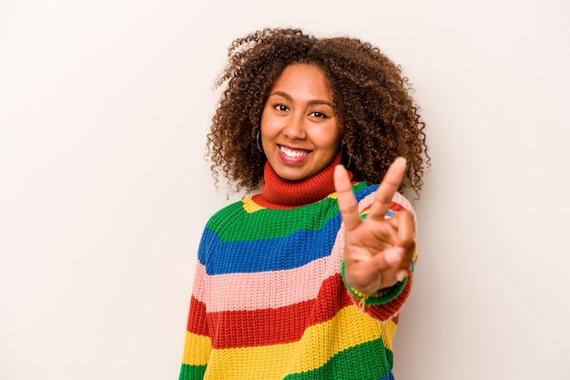 Joyful and carefree showing a peace symbol with fingers