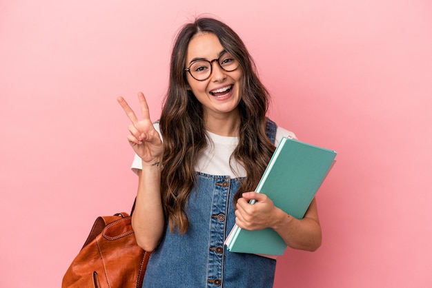 Joyful and carefree showing a peace symbol with fingers