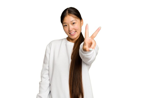 Joyful and carefree showing a peace symbol with fingers