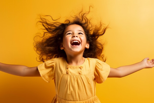 A joyful child spinning with arms wide open isolated on a sunny gradient background