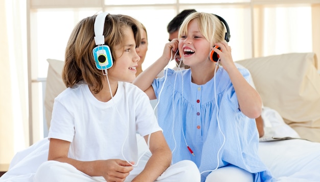 Joyful children having fun and listening music