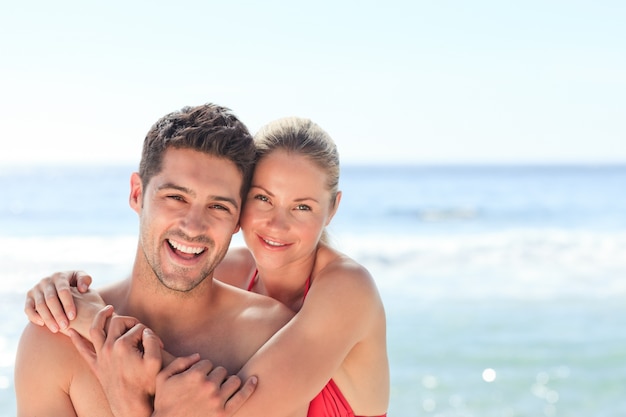 Joyful couple at the beach