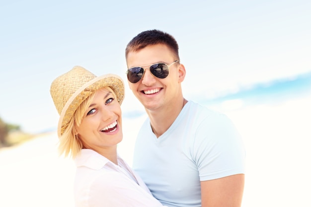 joyful couple having fun at the beach