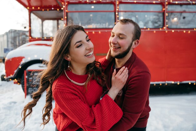 Joyful couple in love have fun outdoors in each other's hugs. High quality photo