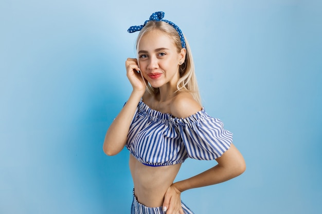 Joyful and excited beautiful blonde girl in summer outfit