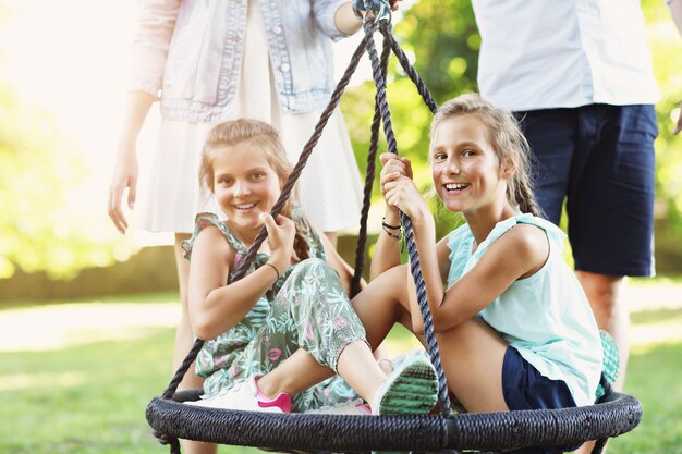 joyful family having fun on playground