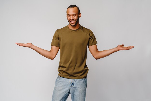 Joyful friendly african-american young man in green t-shirt