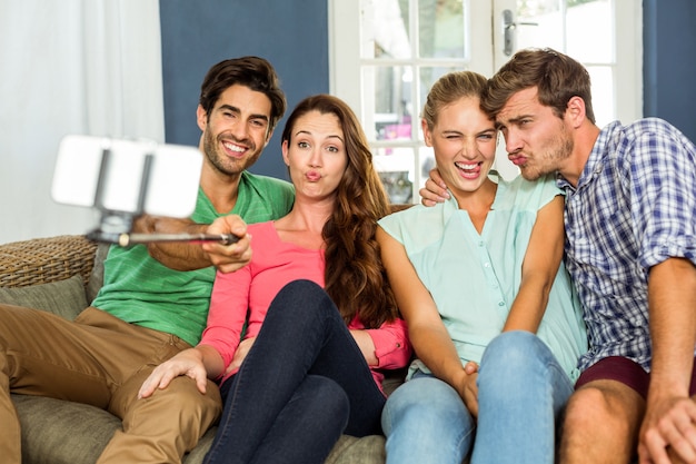 Joyful friends taking selfie