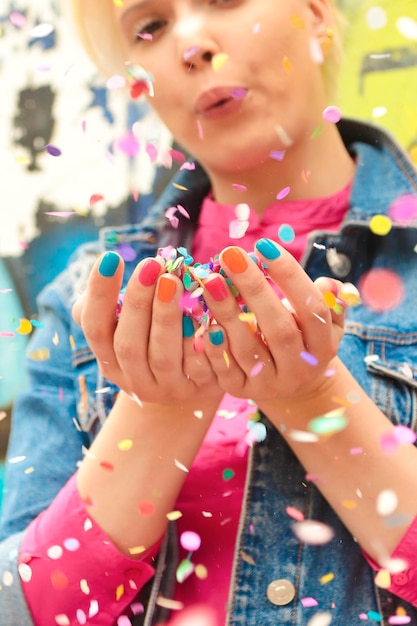 A joyful girl with confetti