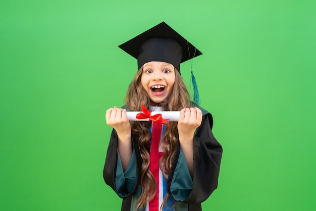 A joyful graduate in a ceremonial robe with a certificate.\
obtaining a certificate in elementary school. the beginning of\
exams in schools.