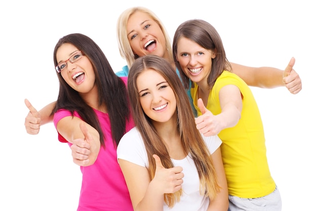 a joyful group of friends showing ok signs over white background