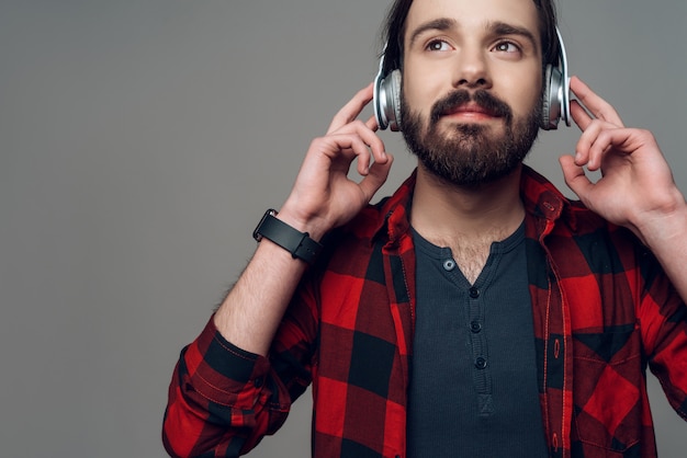 Joyful man listening to music with headphones