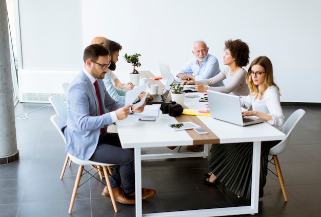 Joyful multiracial business team at work in modern office