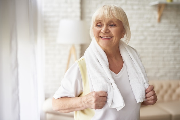 Joyful Pretty Elderly Woman after Morning Workout.