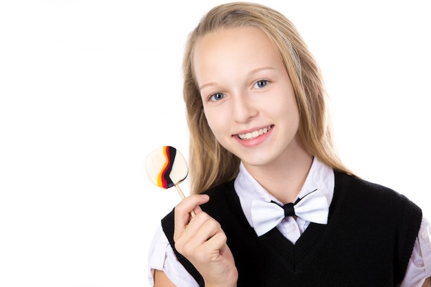 Joyful schoolmeisje met een lolly