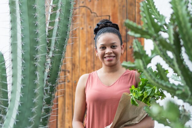 Joyful Urban Gardener with Fresh Herbs