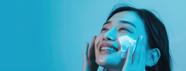 Photo joyful woman applying facial skincare treatment