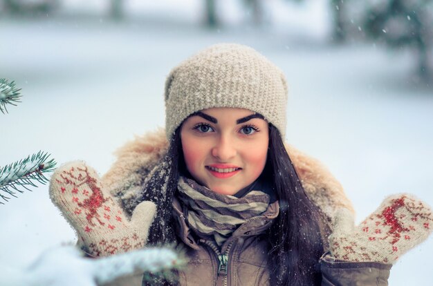 Joyful woman winter portrait in the forest