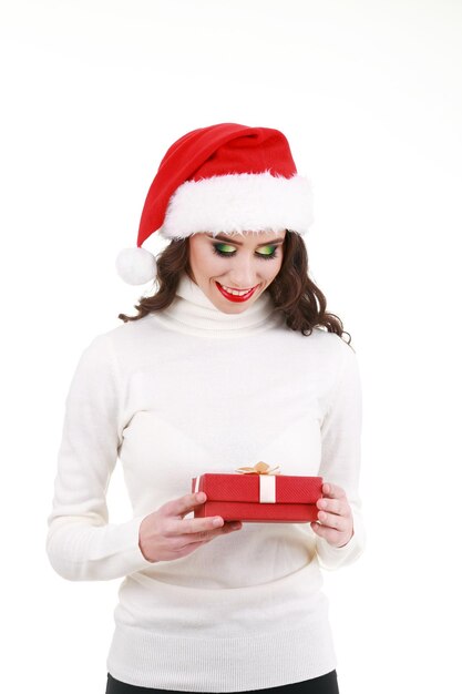 Joyful woman woman holding a lot of boxes with gifts on a white background