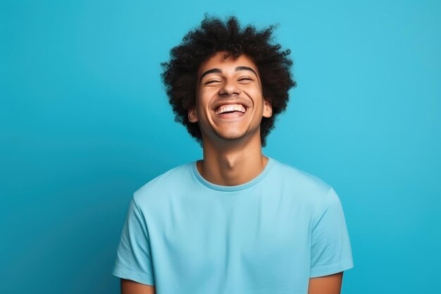 Photo joyful young adult laughing on blue isolation