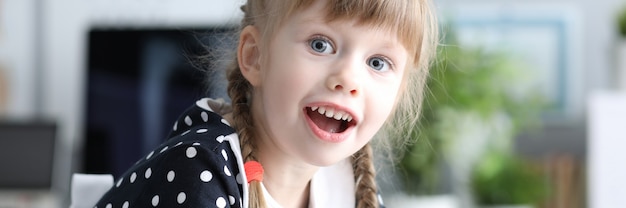 Joyous girl at doctor office