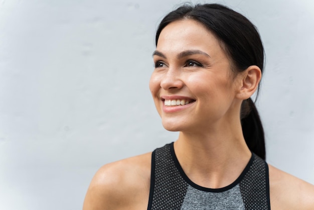 Joyous lady with radiant smile looking away