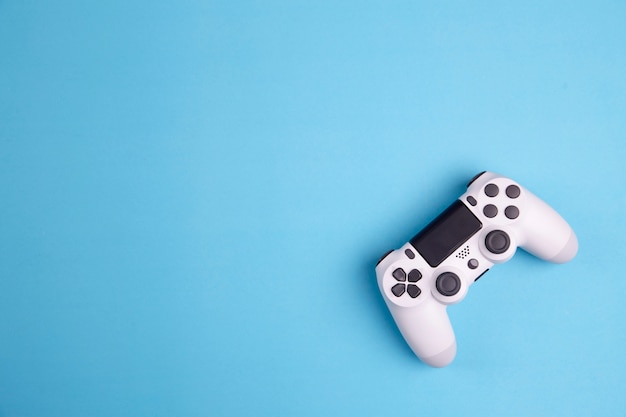 Photo joystick gaming controller isolated on blue background