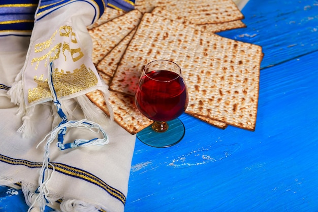 Judaism tradishional religious jewish holiday with matza and cup kosher wine on passover