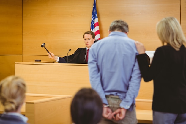 Photo judge about to bang gavel on sounding block