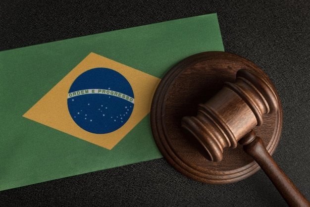 Photo judge or auction gavel on background of flag of brazil constitutional human rights legality concept