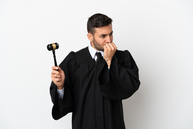 Judge caucasian man isolated on white background having doubts