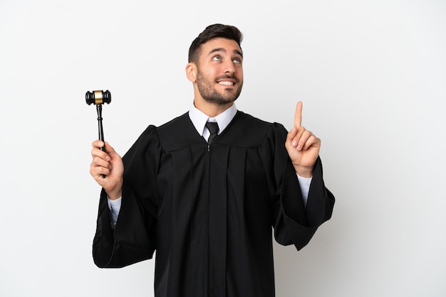 Judge caucasian man isolated on white background pointing up a great idea