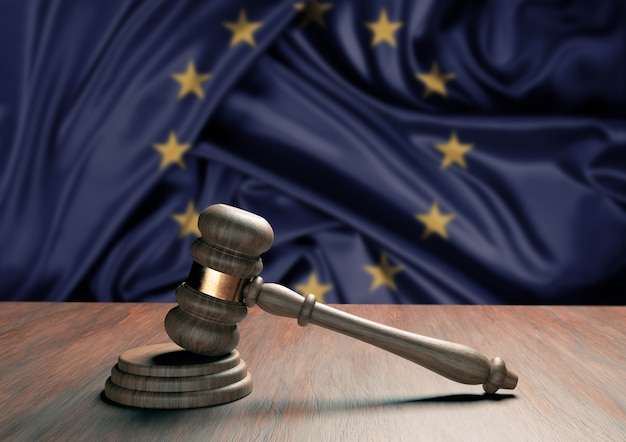 Judge gavel and blur European Union flag in the surface. Law, legislation and justice concept.