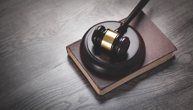 Judge gavel and book on the wooden desk.