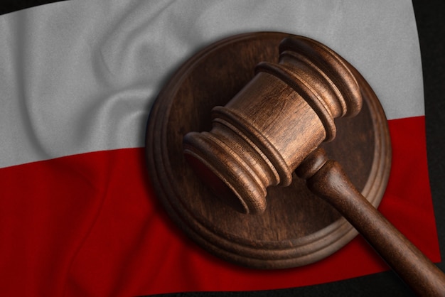 Judge Gavel and flag of Poland. Law and justice in Poland. Violation of rights and freedoms.