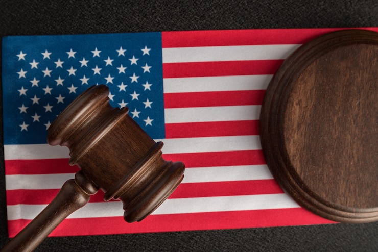 Judge gavel on flag United States of America. Law and Justice. Legal rights and freedom.