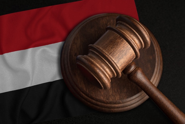 Judge Gavel and flag of Yemen. Law and justice in Republic of Yemen. Violation of rights and freedoms.