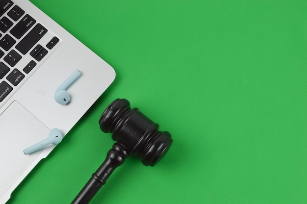 Photo judge gavel laptop and earphones over green background written with privacy act