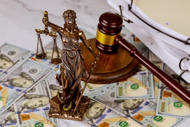 Judge gavel, lawyer office law and justice with a dollar sign corruption and venality concepts