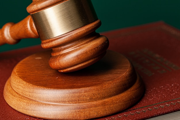 Judge gavel and legal book close up on table