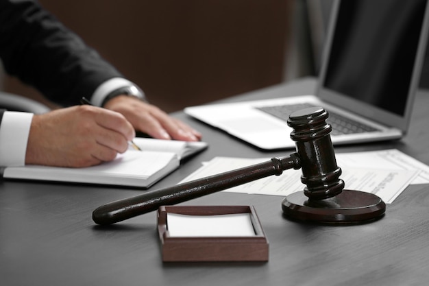 Judge gavel on table closeup