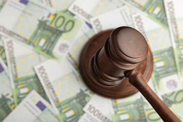 Judge hammer on Euro banknotes background. Judge gavel on the money. Corrupt court.