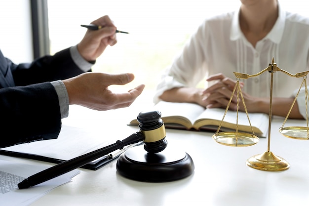 Photo judge or lawyer talking with a client