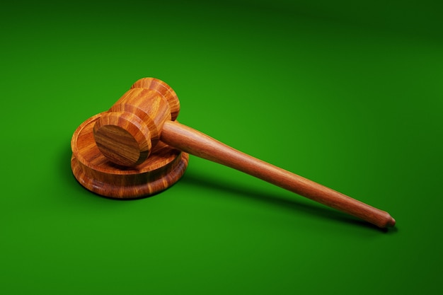 Judge's gavel on green background; law concept; 3d illustration