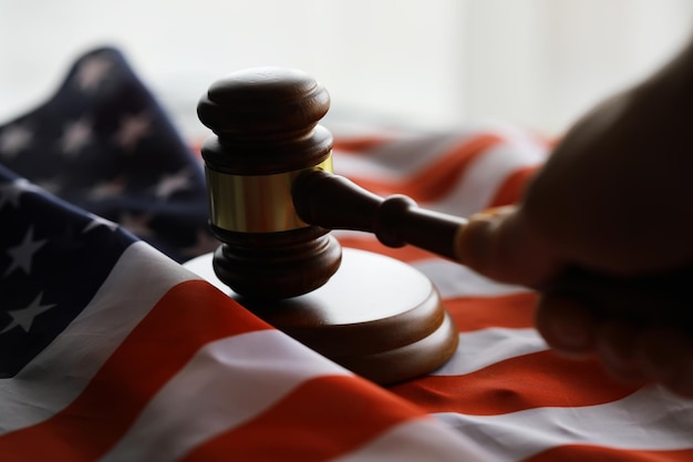 Judge's gavel on the table in focus Cropped view of Judge's hammer for attention and verdict justice judgment at courts of law