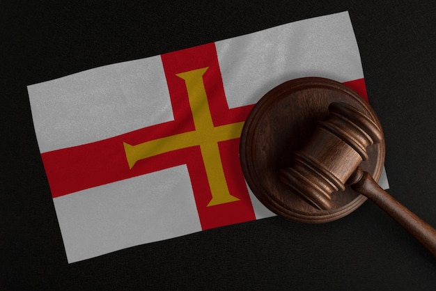 Judges gavel and the flag of Guernsey