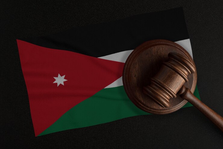 Judges gavel and the flag of Jordan