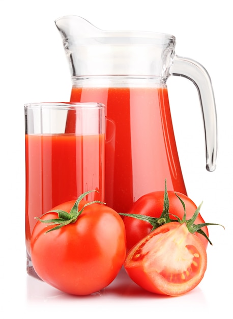 Jug, glass of tomato juice and vegetables isolated