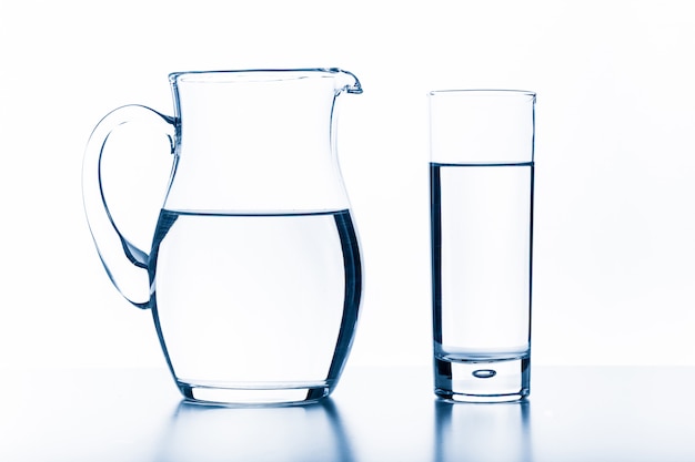 Jug and glass on a white .