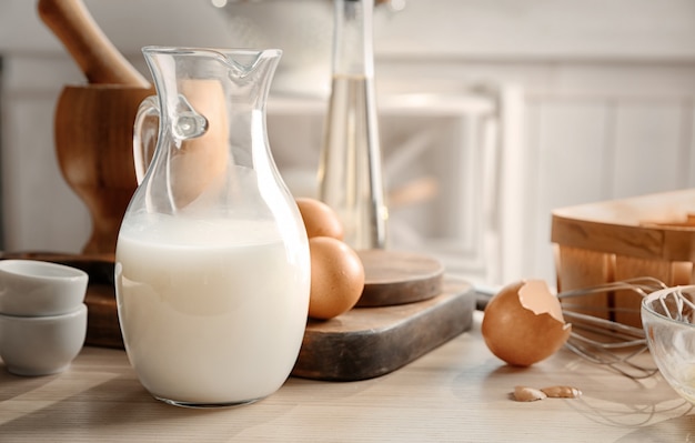 Jug with milk on table